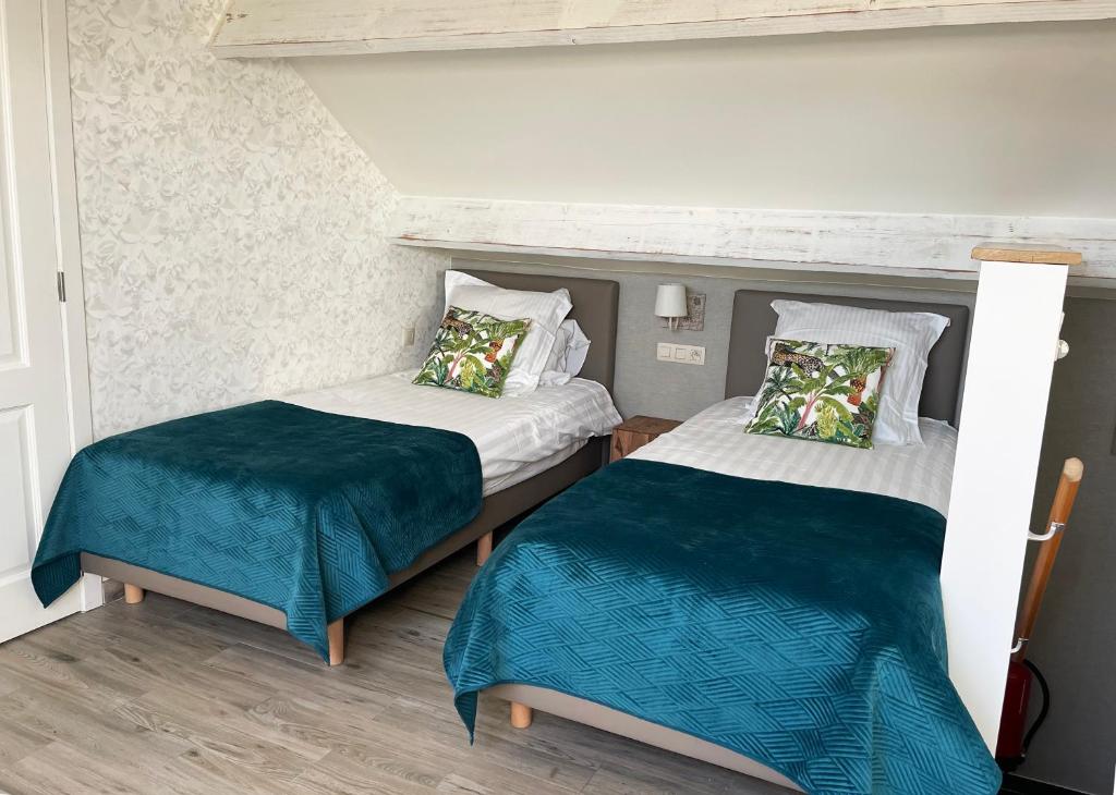 Postel nebo postele na pokoji v ubytování Hotel het Elsland