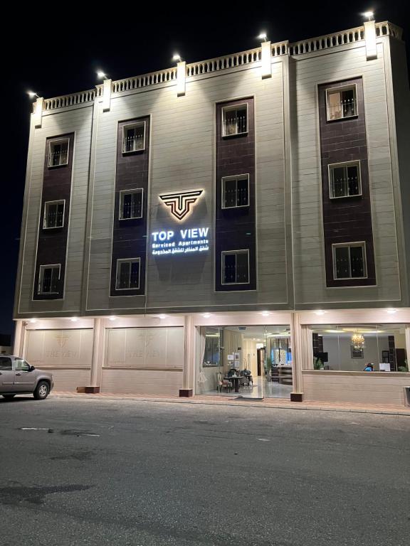 a top view of a building with a car parked in front at Top View - شقق المنظر in Al Hofuf