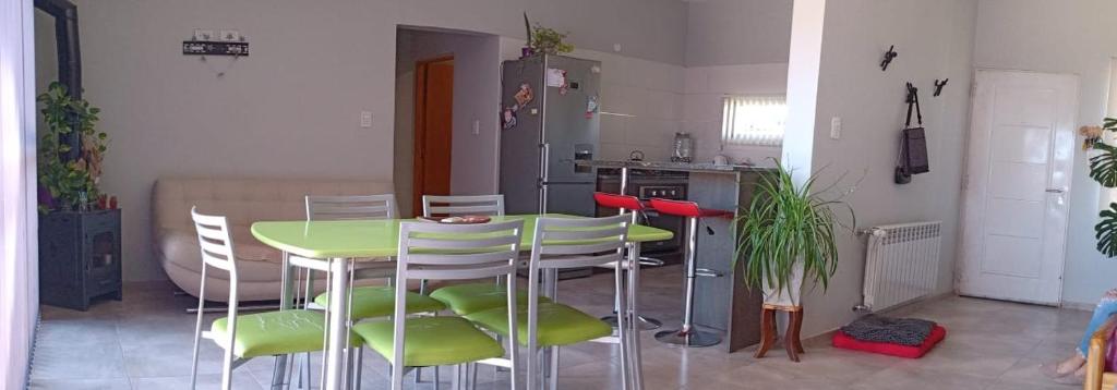 a kitchen with a table and chairs in a room at Mi casa es tu casa!! in Malargüe