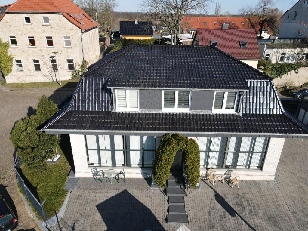 an overhead view of a house with a roof at Elbe Villa Magdeburg in Magdeburg