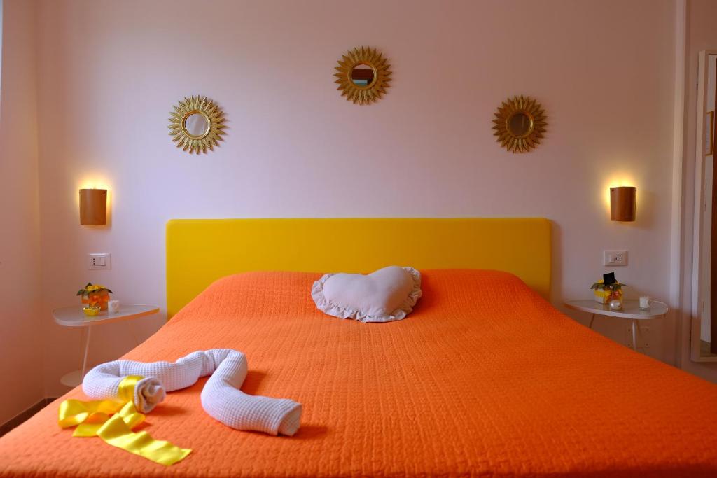 A bed or beds in a room at B&B Il Giardino Stellato