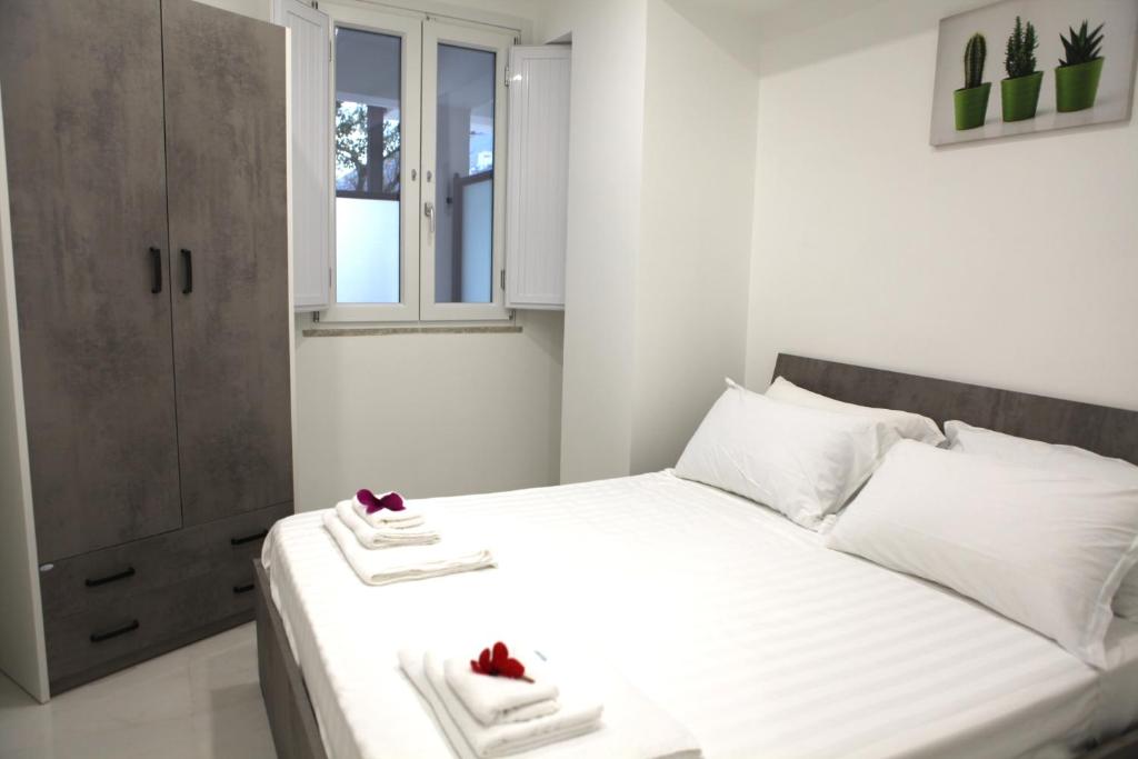 Postel nebo postele na pokoji v ubytování Aretusa Resort Amalfi Coast