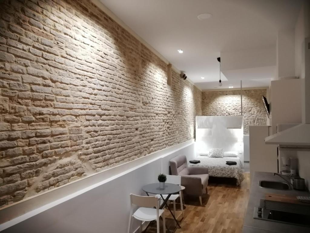 Łóżko lub łóżka w pokoju w obiekcie SALOTUR Sierpes