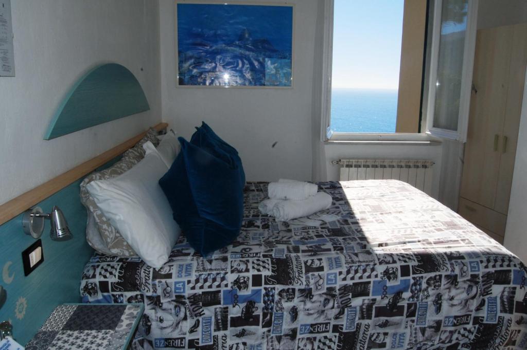 Łóżko lub łóżka w pokoju w obiekcie Corniglia Dreams