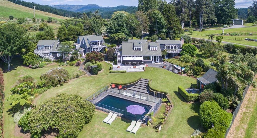 an aerial view of a house with a swimming pool at Brenton Lodge in Whangamata