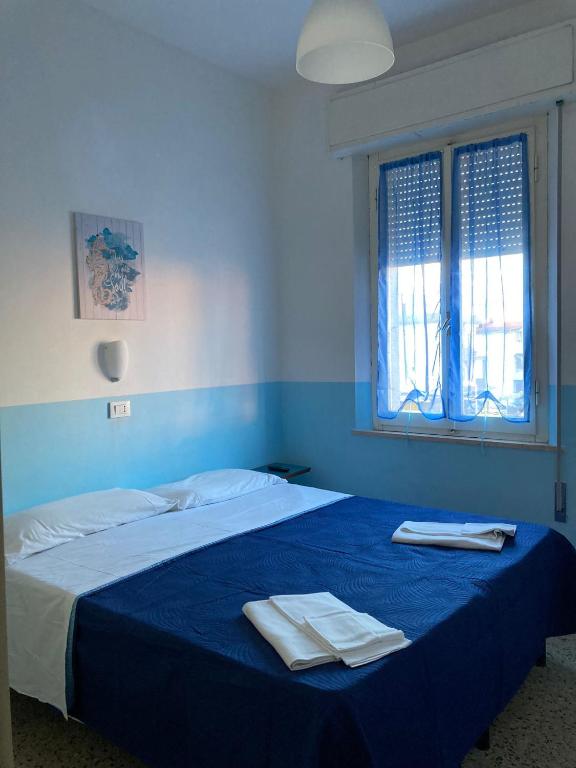 Postel nebo postele na pokoji v ubytování New Hotel Villa Enea