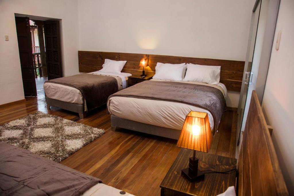 Postel nebo postele na pokoji v ubytování Hotel Casa Fierro Cusco