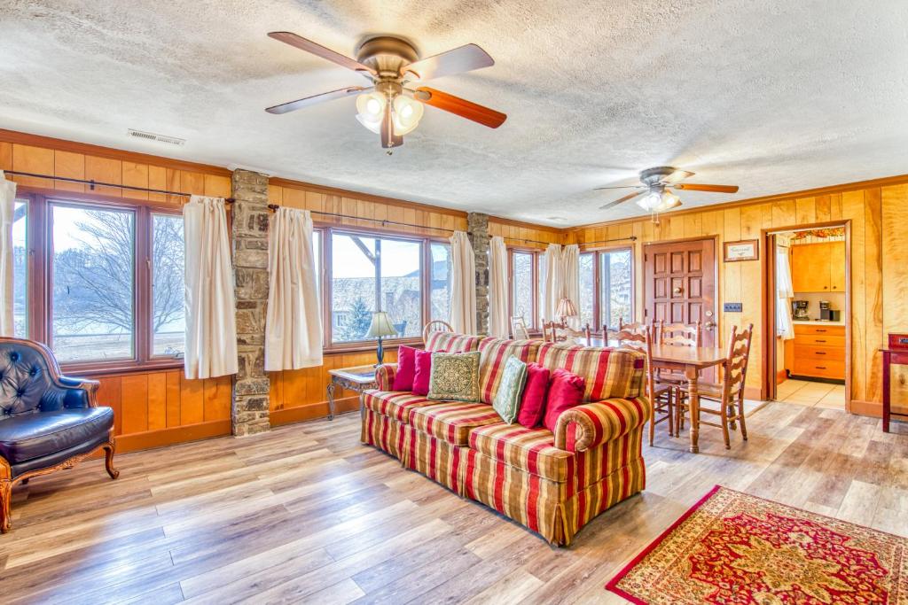 a living room with a couch and a table at Morris Villa in Lake Junaluska