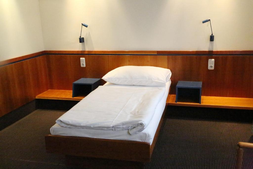 Postel nebo postele na pokoji v ubytování Prielmayerhof HOTEL