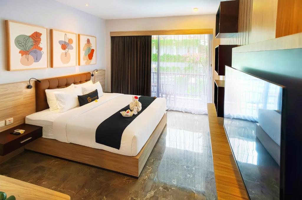 Postel nebo postele na pokoji v ubytování Graha Socio Hotel Nusa Dua Bali
