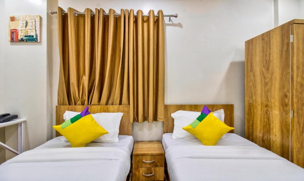 Postel nebo postele na pokoji v ubytování Itsy Hotels Shri Guru Service Apartment