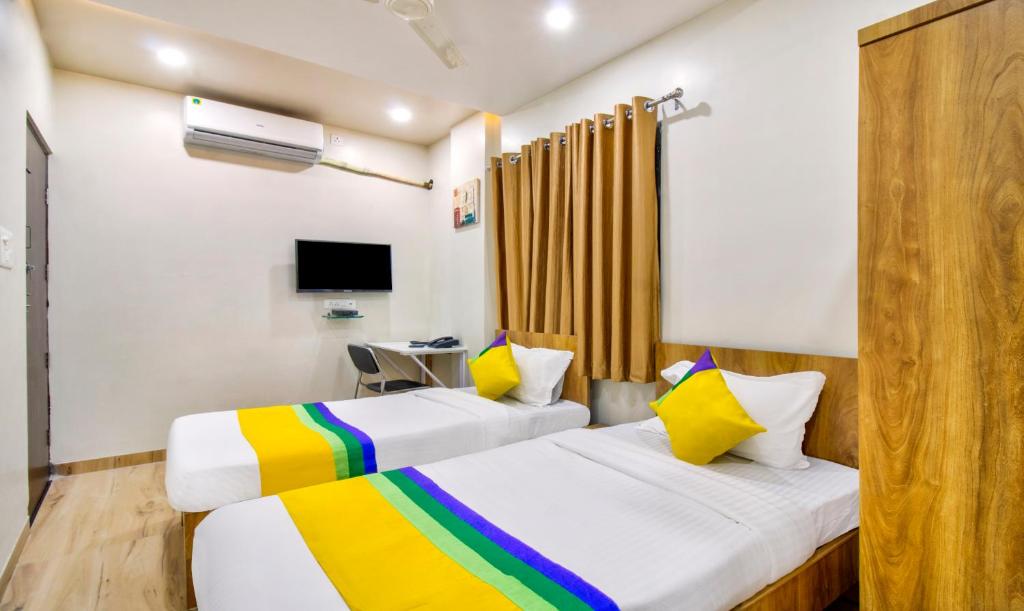 Postel nebo postele na pokoji v ubytování Itsy Hotels Shri Guru Service Apartment