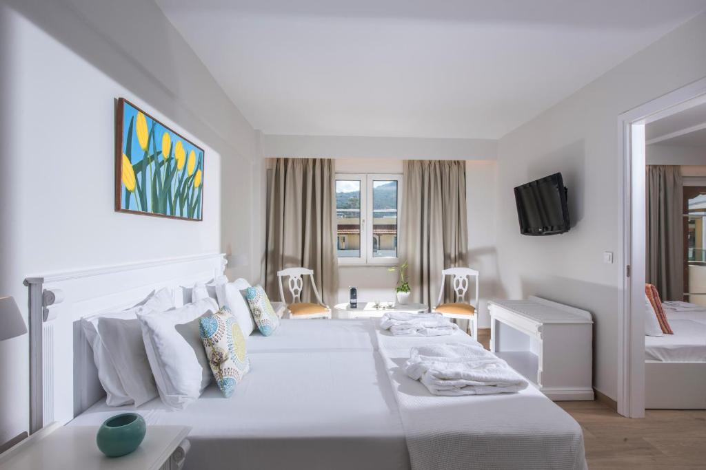 Posteľ alebo postele v izbe v ubytovaní Alexander House Hotel