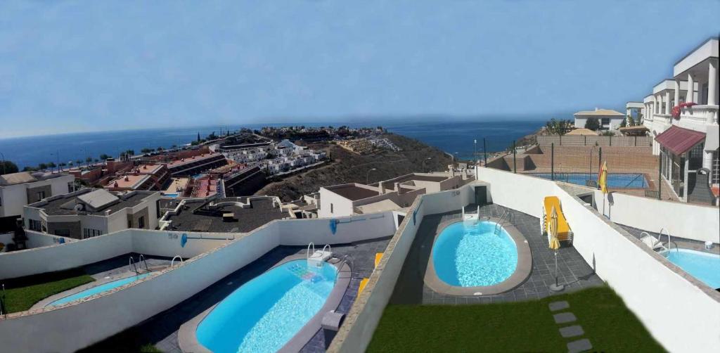 Πισίνα στο ή κοντά στο Mirador del Mar Villas