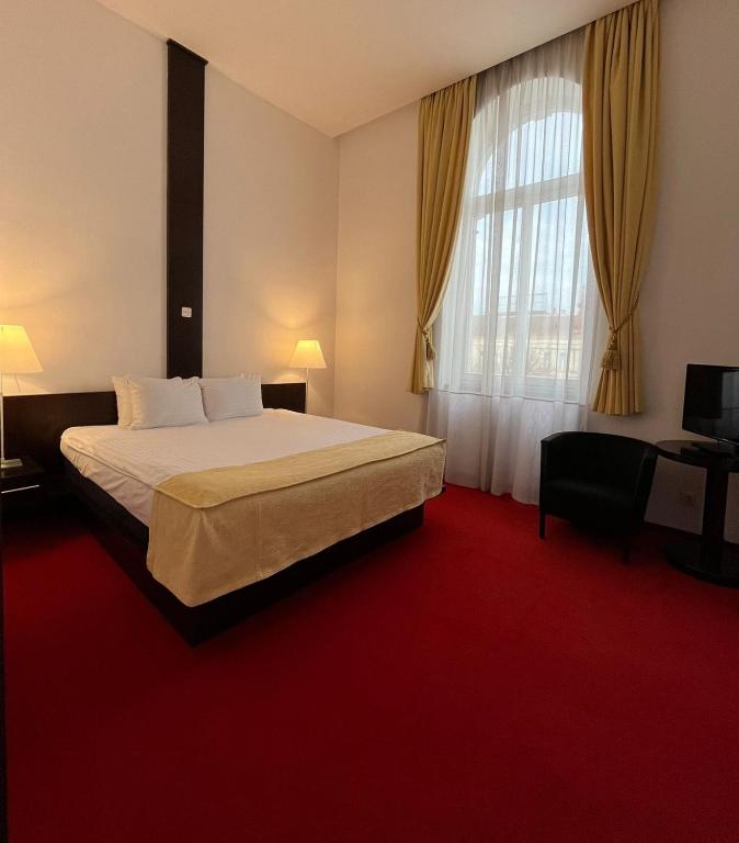 Postel nebo postele na pokoji v ubytování Hotel Concordia