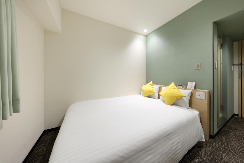 Postel nebo postele na pokoji v ubytování Cityroute Hotel