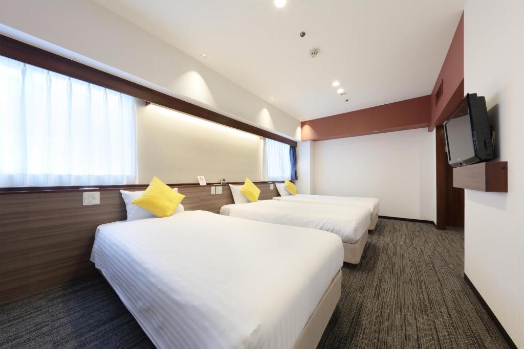 Postel nebo postele na pokoji v ubytování Cityroute Hotel