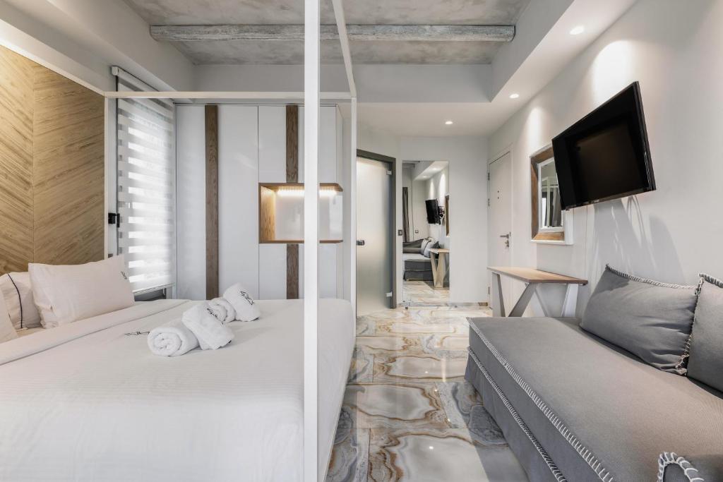 Łóżko lub łóżka w pokoju w obiekcie Blue Carpet Luxury Suites