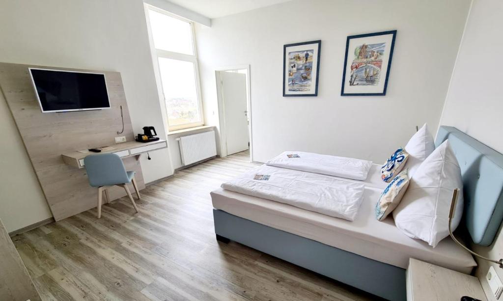 TV a/nebo společenská místnost v ubytování Nordsee Hotel Borkum