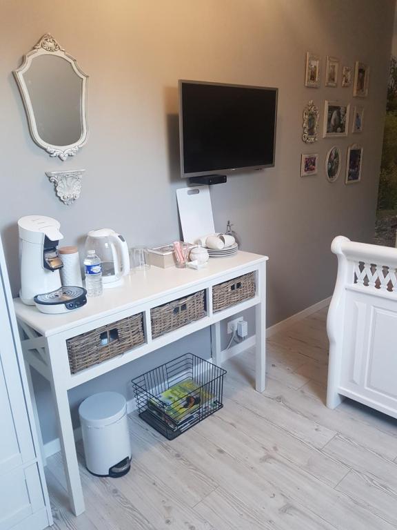 TV a/nebo společenská místnost v ubytování B&B Le Jardin