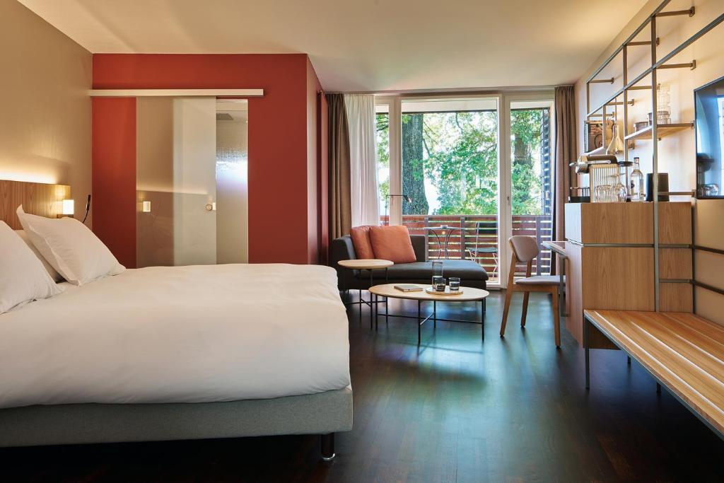 Llit o llits en una habitació de Sorell Hotel Zürichberg