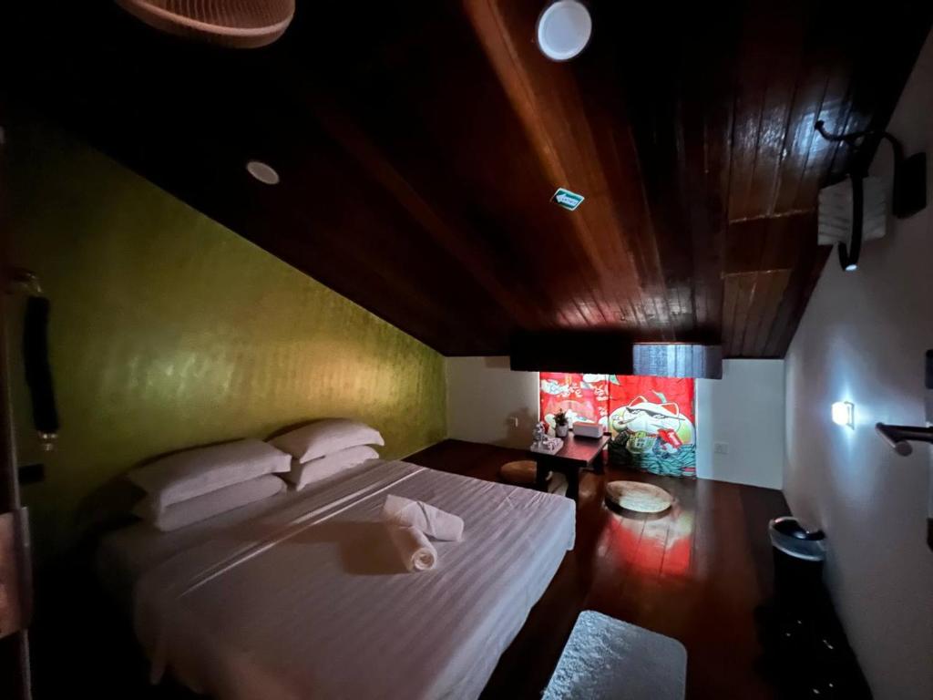 Postel nebo postele na pokoji v ubytování Flypod . Kinabalu Mt Lodge