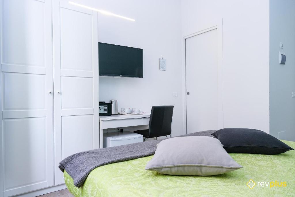 Postel nebo postele na pokoji v ubytování Lia Rooms