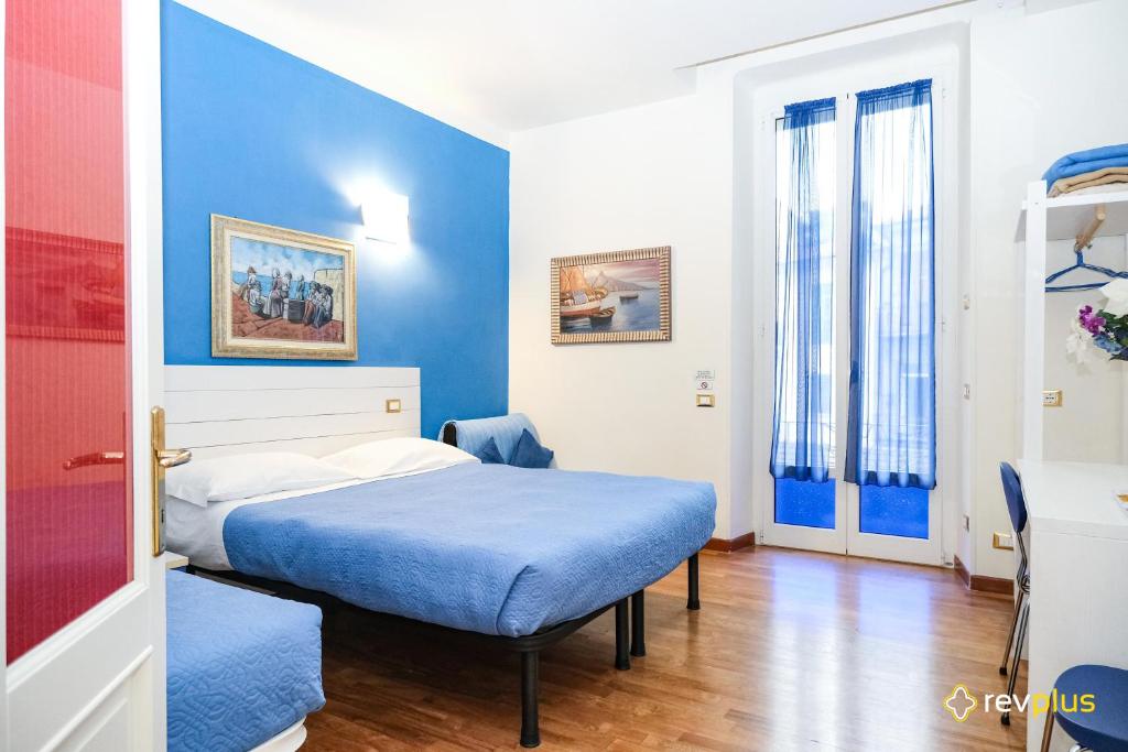 Postel nebo postele na pokoji v ubytování Lia Rooms