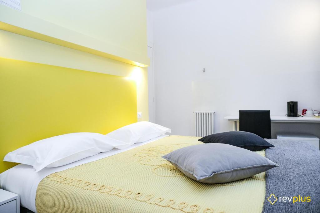 Postel nebo postele na pokoji v ubytování Lia Rooms
