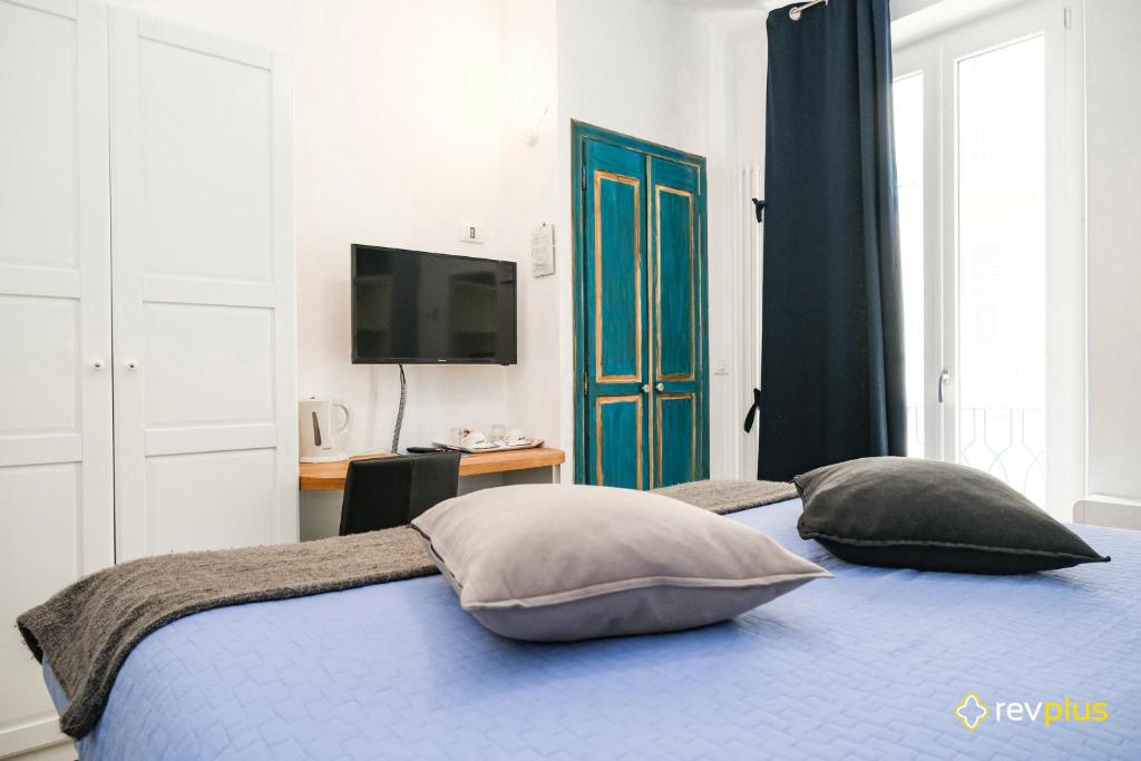 Postel nebo postele na pokoji v ubytování Lia Rooms