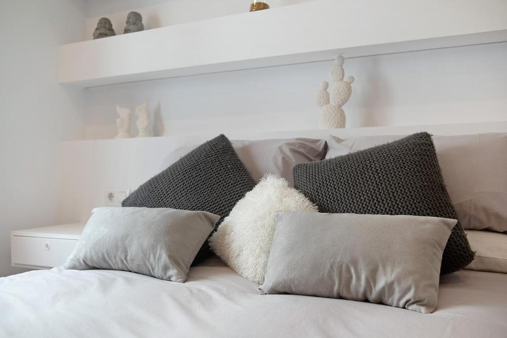 Łóżko lub łóżka w pokoju w obiekcie Apartamento Sol - Sólo Familias