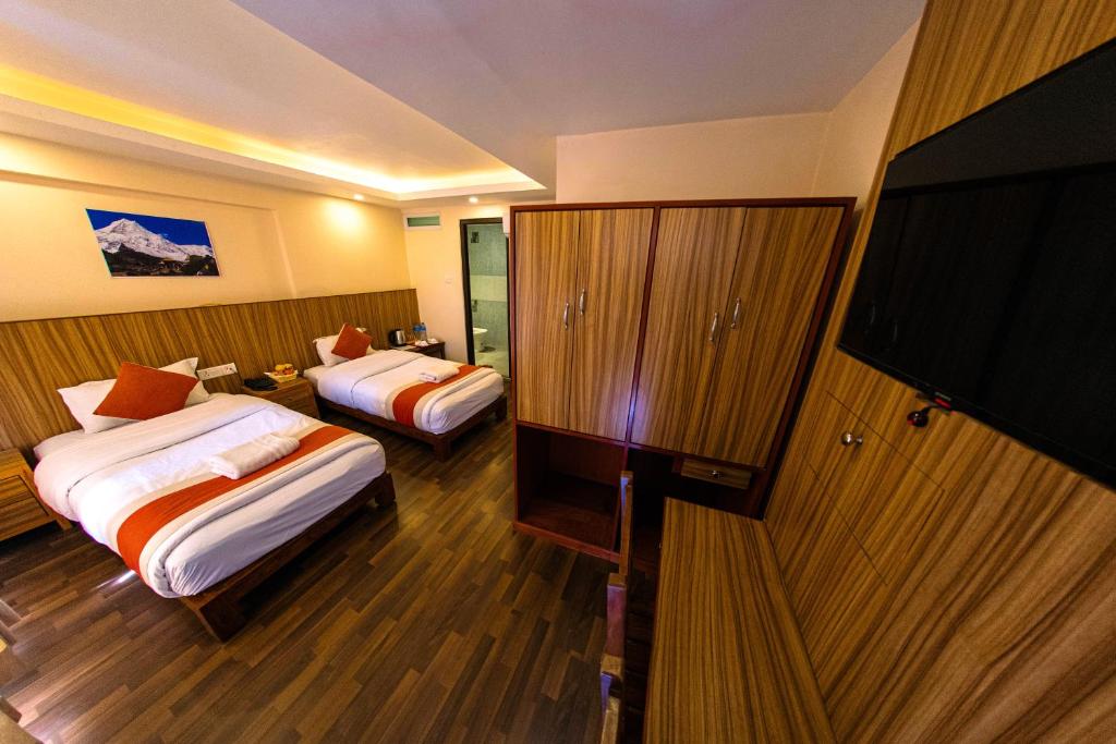 Letto o letti in una camera di Hotel Chhimeki