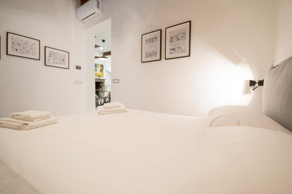 Łóżko lub łóżka w pokoju w obiekcie San Lorenzo Apartment