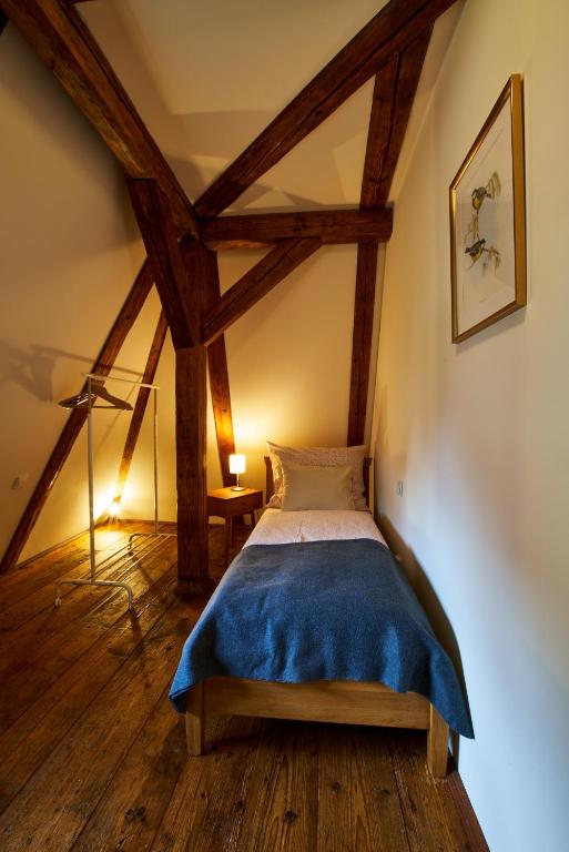 Postel nebo postele na pokoji v ubytování Barokní kaplanka 1796 A. D. - luxusní apartmány v Českém ráji