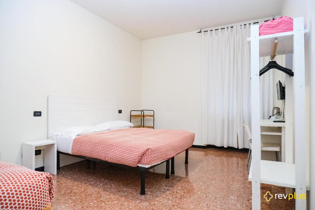 a bedroom with a bed and a book shelf at Lia Rooms 3 in La Spezia