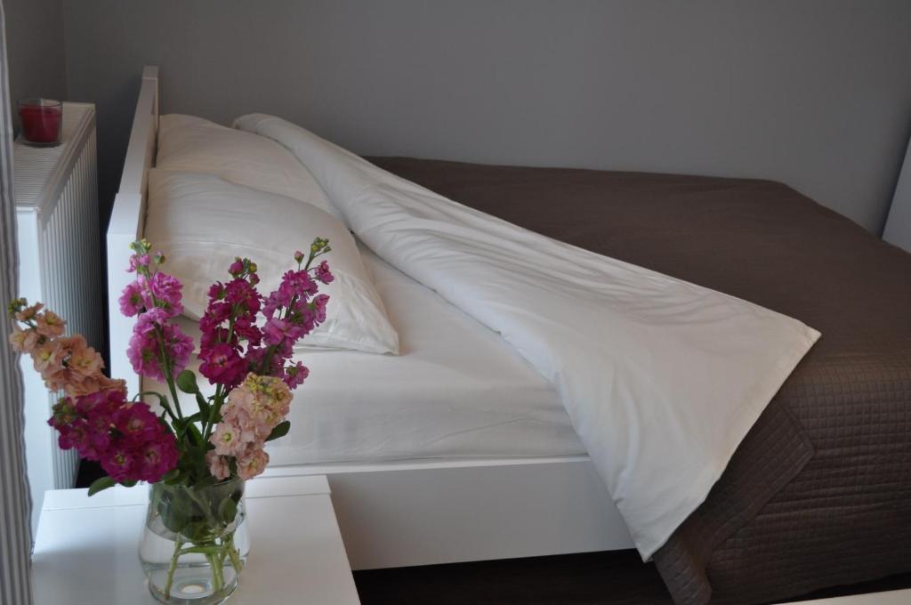 Postel nebo postele na pokoji v ubytování Apartament we Władysławowie