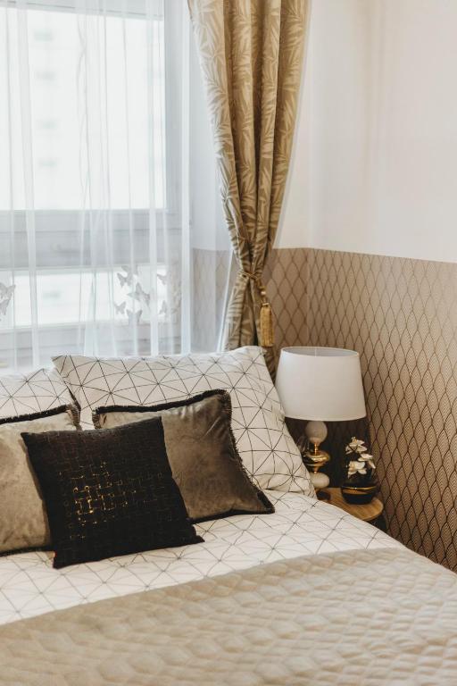 Posteľ alebo postele v izbe v ubytovaní ClickTheFlat Gdański Center Prestige Apart Rooms