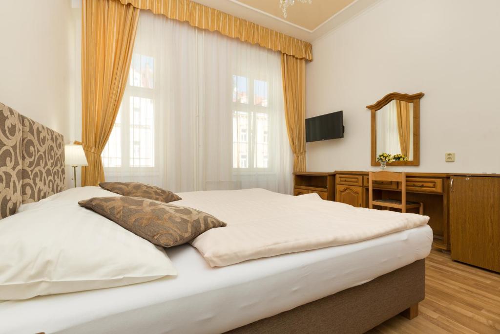 Postel nebo postele na pokoji v ubytování LD Morava