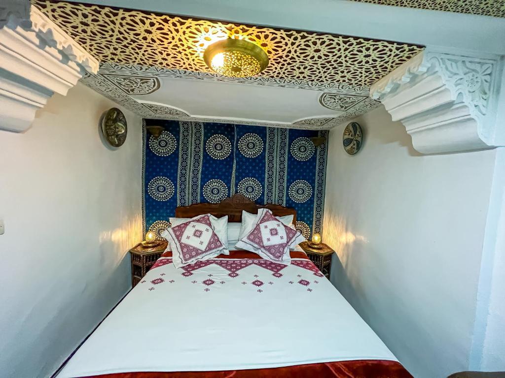 Postel nebo postele na pokoji v ubytování Riad Dar Guennoun