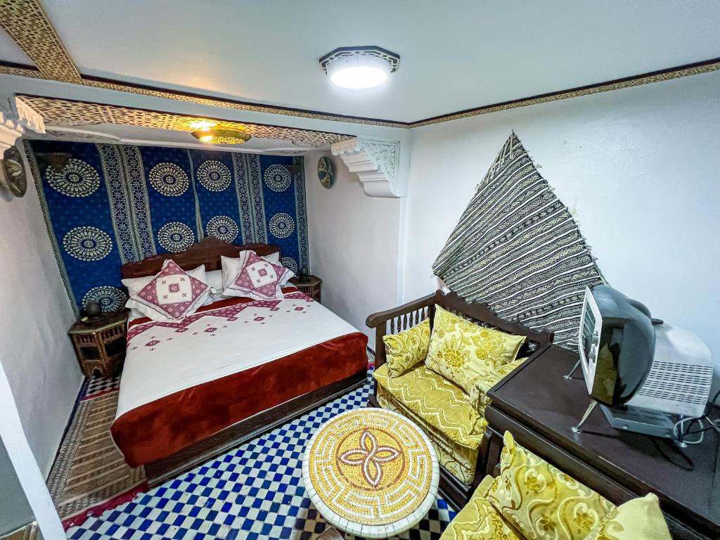 Postel nebo postele na pokoji v ubytování Riad Dar Guennoun