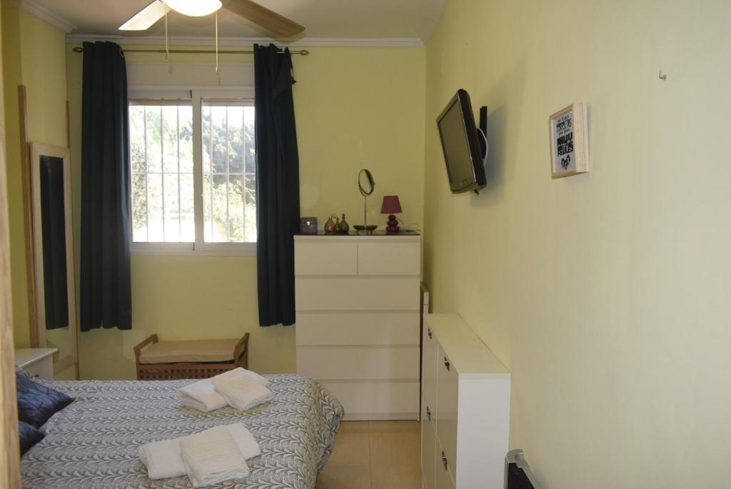 Postel nebo postele na pokoji v ubytování Anacasa Los Sauces Nova Denia PB2234