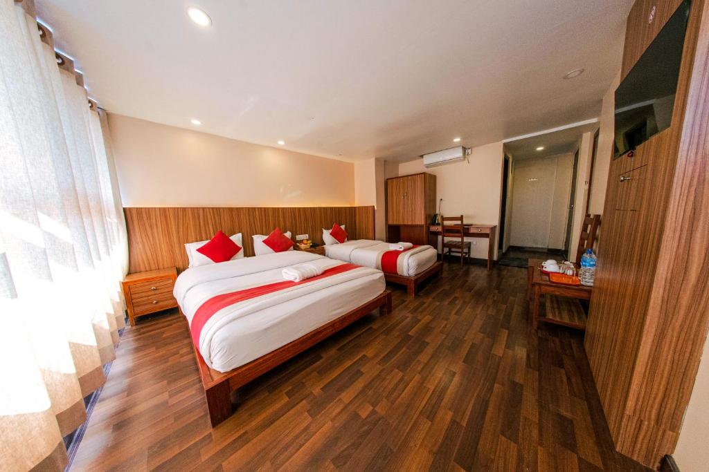 Letto o letti in una camera di Hotel Chhimeki