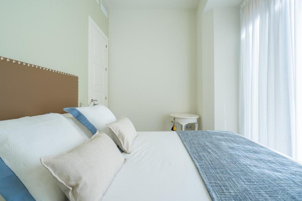 A bed or beds in a room at iloftmalaga Calle Cisneros