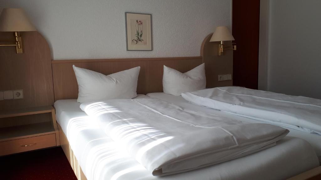 Postel nebo postele na pokoji v ubytování Hotel Park Eden