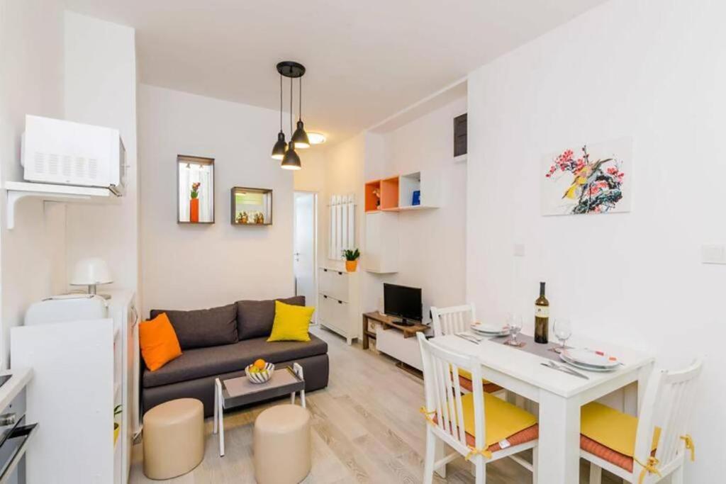 a living room with a couch and a table at Dubrovnik: Apartment Quiet Corner in Dubrovnik