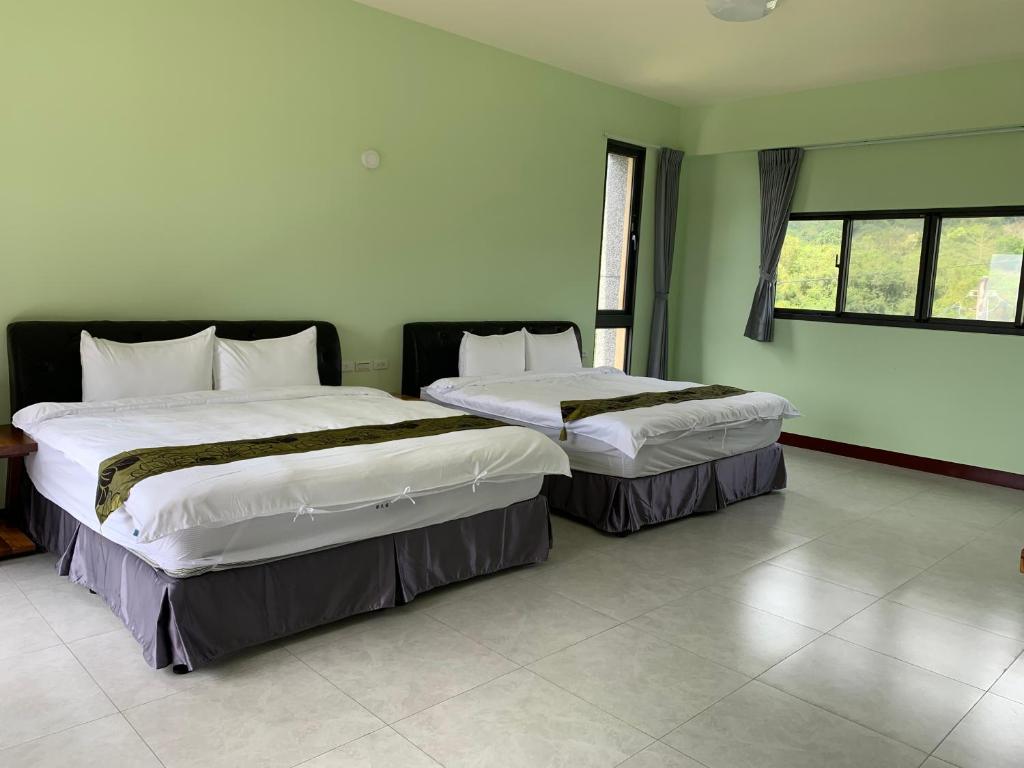 Postel nebo postele na pokoji v ubytování Yuan Homestay