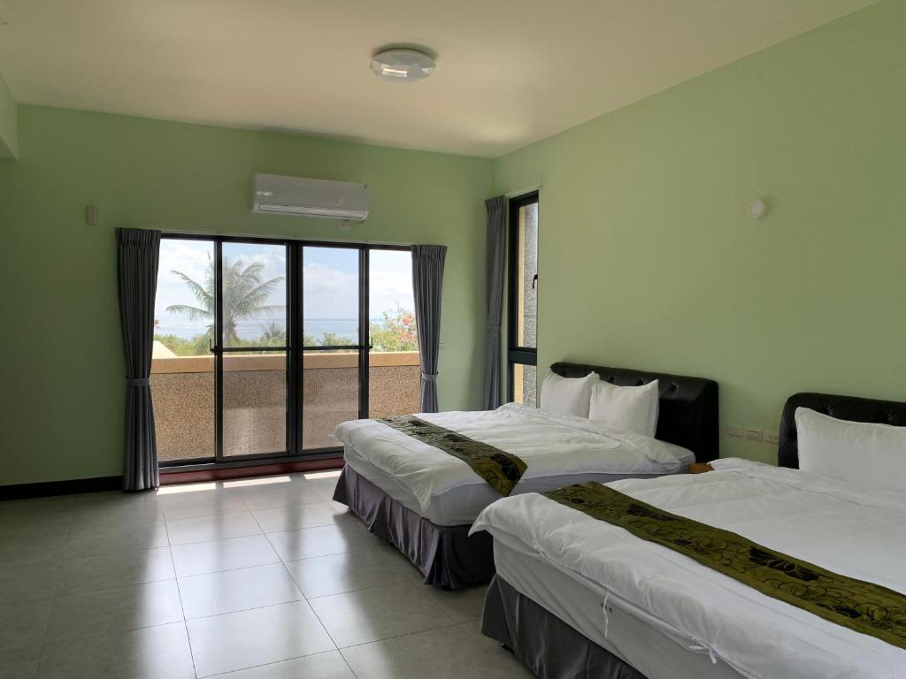 Postel nebo postele na pokoji v ubytování Yuan Homestay