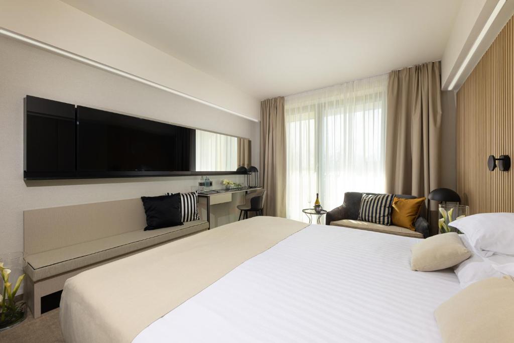 A bed or beds in a room at LUA Resort - Adults only