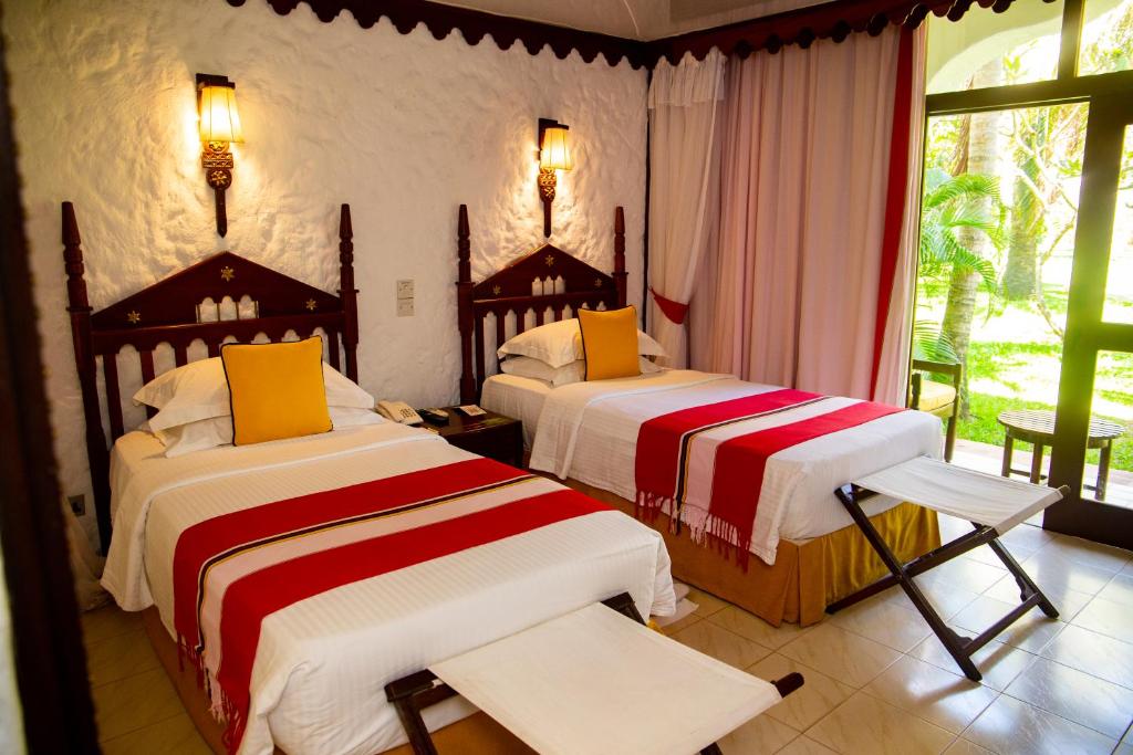Postel nebo postele na pokoji v ubytování Serena Beach Resort & Spa