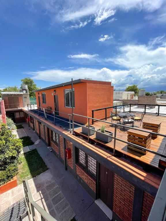 a building on top of a building with a balcony at complejo 25 de mayo in Guaymallen